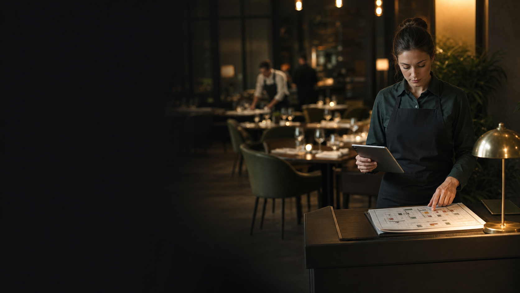 Restaurant team reviewing bookings and table availability before service.