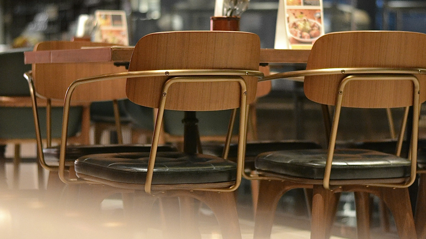 An empty restaurant table with chairs ready for service.