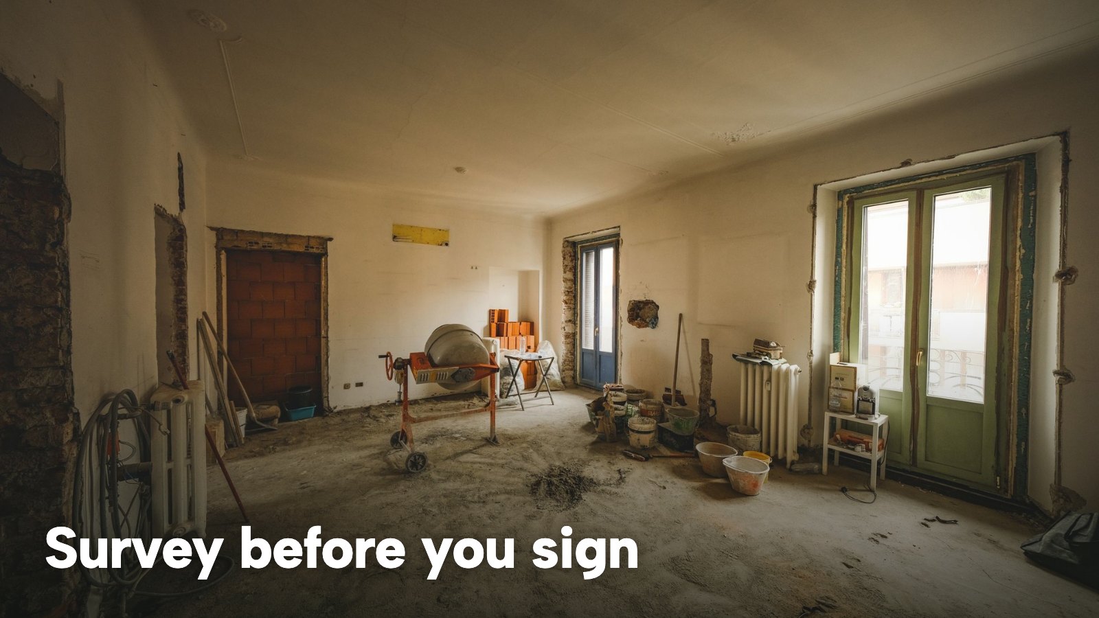 A sunlit room under renovation with building materials on the floor. The image carries the words "Survey before you sign".