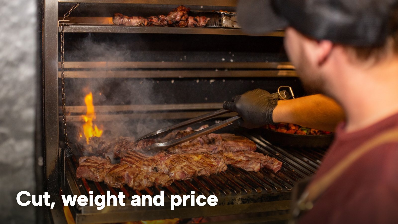 A chef grilling steaks over an open flame, with smoke rising. The image carries the words "Cut, weight and price".